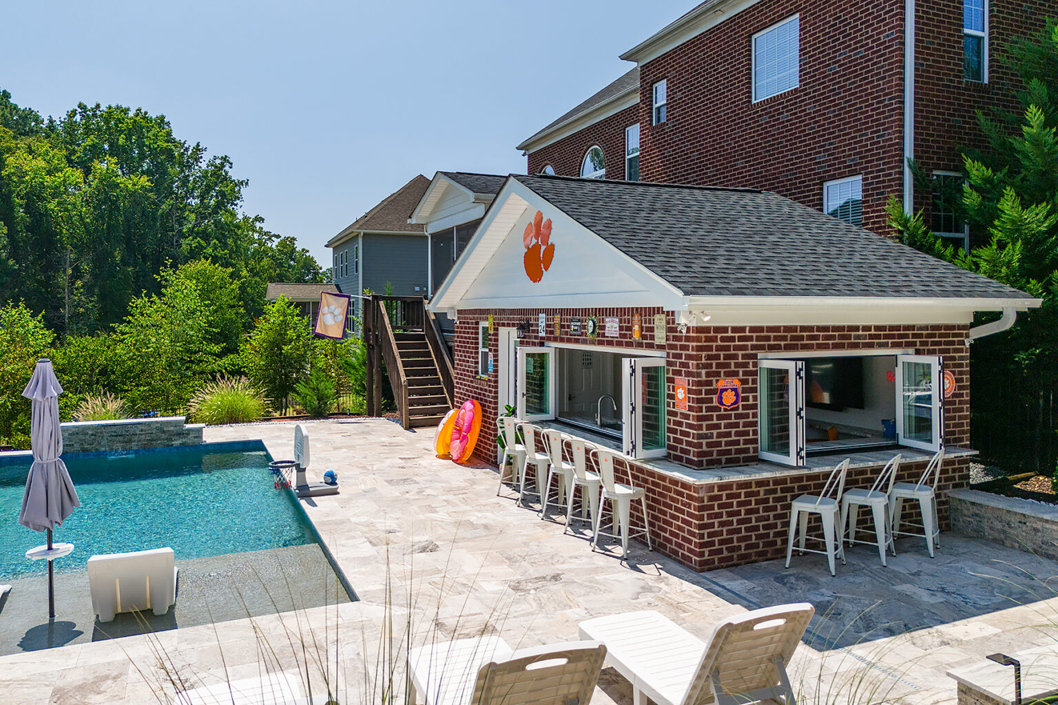Aerial view of a completed pool house and pool in a Harrisburg backyard